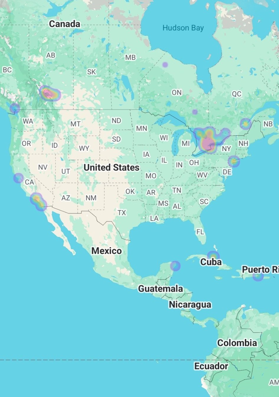 Google Photos heatmap of Herman's photos across America, with clusters in Ontario, New York, the Pacific Northwest, Los Angeles, Cuba, and Puerto Rico